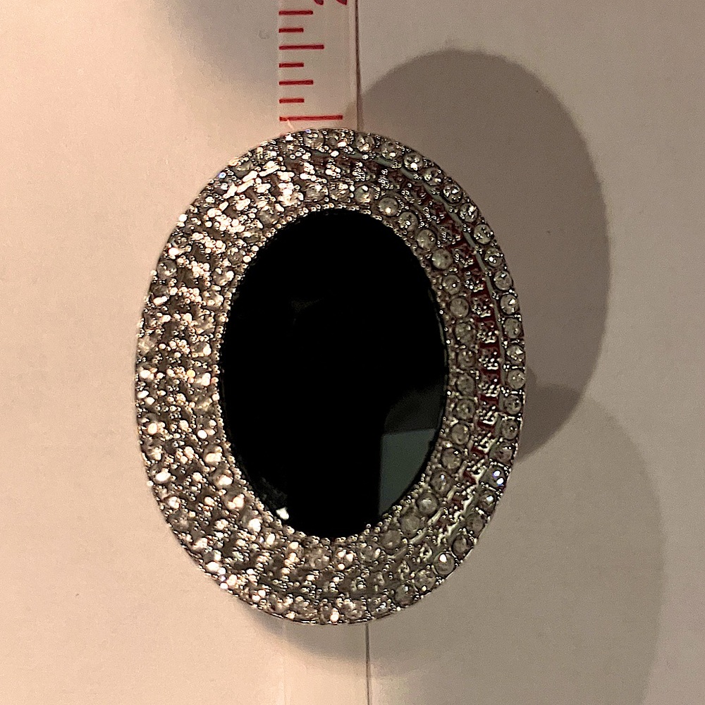 Round black ring with silver accents